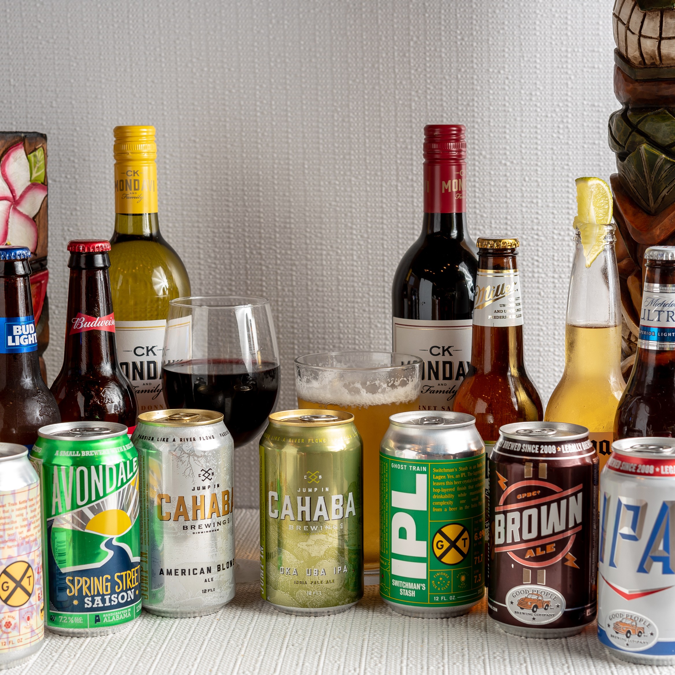 Assorted drinks and beverages on the bar, including cocktails and soft drinks.